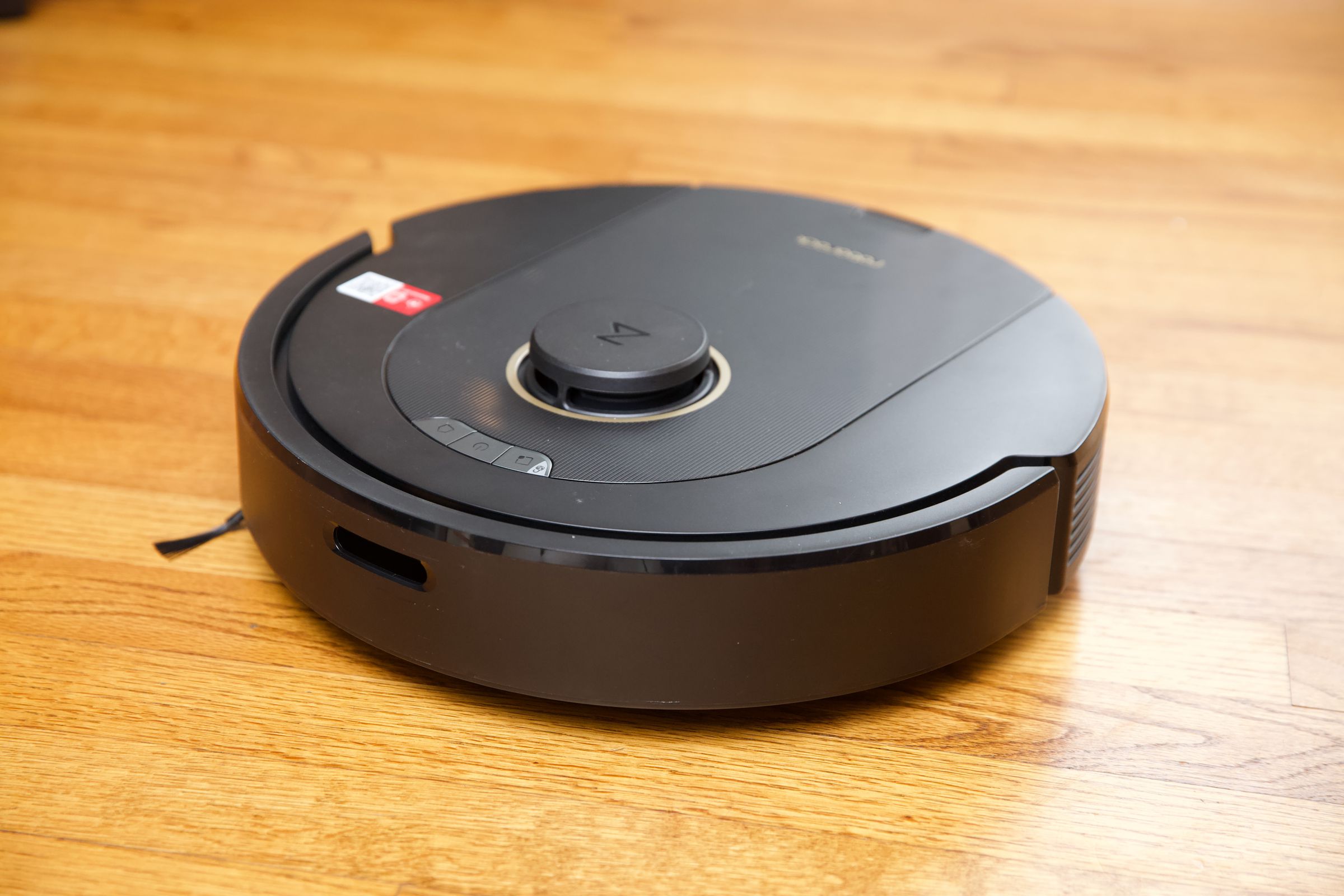 Roborock’s Q5 Pro on a hardwood floor.